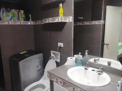a bathroom with a sink and a toilet and a mirror at Cartagena Sotavento Laguito in Cartagena de Indias