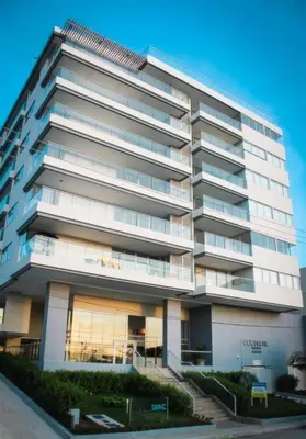 a large white building with stairs in front of it at OceanDrive509 in Cartagena de Indias