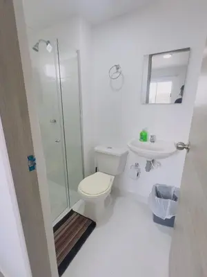 a bathroom with a shower and a toilet and a sink at Beach Lotus 1203 in Cartagena de Indias