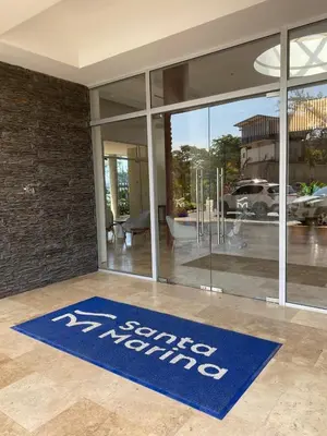 a blue sign that reads service monitoring in front of a building at BRISA MARINA, Santa Marina Condominio in Santa Marta