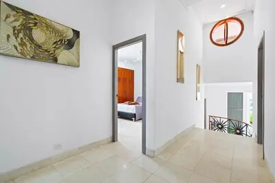 a hallway with a door leading to a bedroom at 10BR Mansion Beachfront w Pool and Disco in Cartagena de Indias