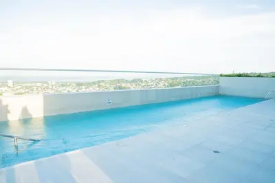 a swimming pool on the roof of a building at Luxury apartment with ocean view 15th floor in Cartagena de Indias