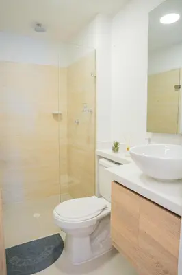 a bathroom with a toilet and a sink at Luxury apartment with ocean view 15th floor in Cartagena de Indias
