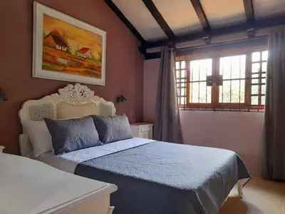 a bedroom with a bed and a window at Habitación Luminosa Manga in Cartagena de Indias