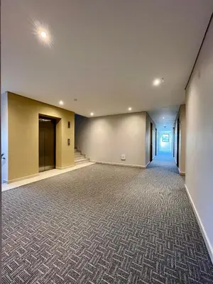 an empty room with a large wall at BQ84 Urban Hotel in Barranquilla