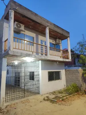 a house with a balcony on top of it at Playa Maru in Santa Veronica