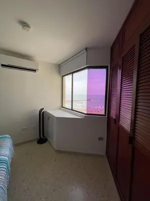 a room with a large window in a room at Apartamento con la mejor ubicación y vista al mar in Cartagena de Indias