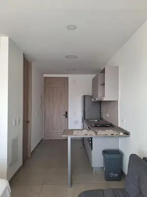 a kitchen with a counter top in a room at Santa Marina Modern Loft Santa Marta in Santa Marta
