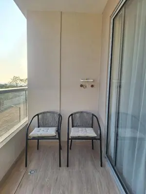 two chairs sitting in a room with a window at Santa Marina Modern Loft Santa Marta in Santa Marta
