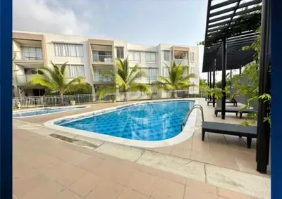 a swimming pool in front of a building at Serena Del Mar Apartment in Cartagena de Indias