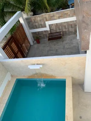 an overhead view of a swimming pool with a bench at Hostel - La Catalina PLus in Cartagena de Indias