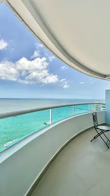 a balcony with a view of the ocean at Vive al estilo Cartagenero frente al mar y al lago in Cartagena de Indias