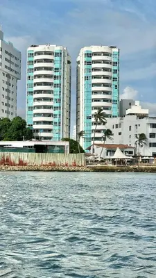 a body of water with tall buildings in the background at Vive Cartagena magica frente al mar y lago in Cartagena de Indias