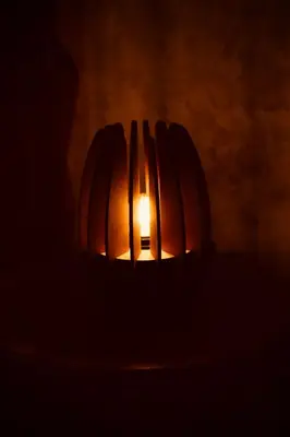 a lit pumpkin in the dark with a candle at Cuna 58 in Barranquilla