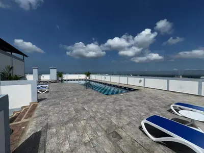 a swimming pool on the roof of a building at NEW Premium 1BR Apartment in the Best Area in Barranquilla