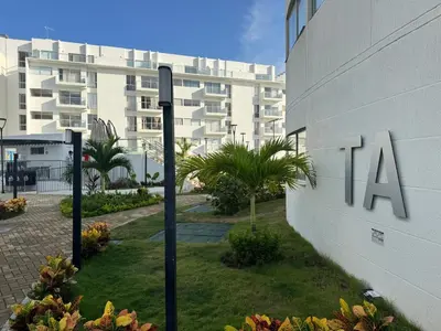a building with a sign on the side of it at Apartamento Serena del mar Trevi in Cartagena de Indias