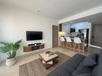 a living room with a couch and a table at Apartamento Serena del mar Trevi in Cartagena de Indias