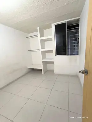 a room with white shelves and a window at Apartamento acogedor y fresco cerca al norte de barranquilla in Barranquilla