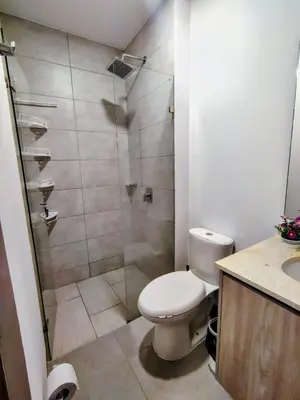 a bathroom with a toilet and a shower at Apartamento de lujo en Santa Marta in Santa Marta