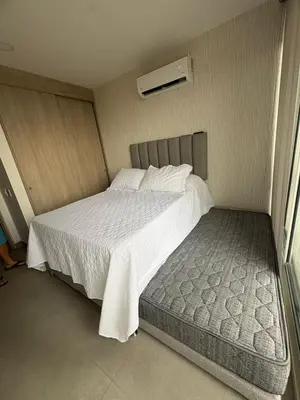 a small bedroom with a bed and a window at Cardona Suite Santa Marina Santa Marta in Santa Marta