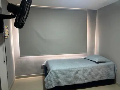 a room with a bed and a large window at Gisela Wax More Guess Room in Cartagena de Indias