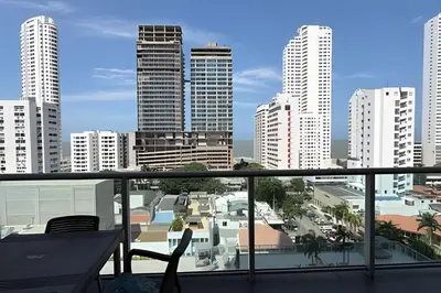 a balcony with a view of a city at Hermoso Apto de 1 hab con Vista al Mar - Piso 10 in Cartagena de Indias