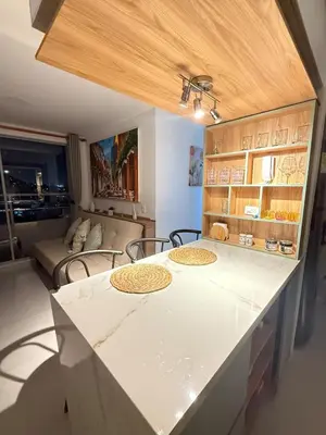 a kitchen with a table with chairs and a couch at Caribbean Deluxe Apartment Walk to Beach WiFi in Cartagena de Indias