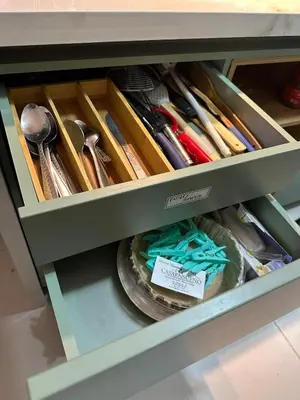 a drawer in a cabinet filled with lots of utensils at Caribbean Deluxe Apartment Walk to Beach WiFi in Cartagena de Indias