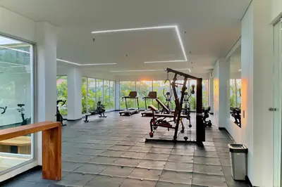 a room with a gym with a treadmill at 1 Recamara, Laguna, Paddleboard, Gym y Jacuzzi in Cartagena de Indias