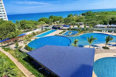 an aerial view of a resort with two pools at Modern Balcony Apartment with Sea View! in Santa Marta