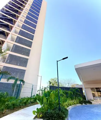 a building with a swimming pool in front of a building at Modern Balcony Apartment with Sea View! in Santa Marta