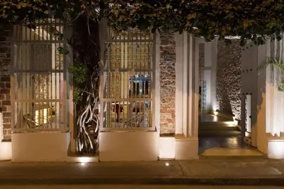 a building with a gate with lights on it at NOK Luxury Colonial Villa 6BR with Pool Staff & Breakfast at Getsemani in Cartagena de Indias