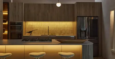 a kitchen with a island with stools and a counter top at NOK Luxury Colonial Villa 6BR with Pool Staff & Breakfast at Getsemani in Cartagena de Indias