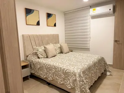a small bedroom with a bed in a room at refugio moderno in Barranquilla