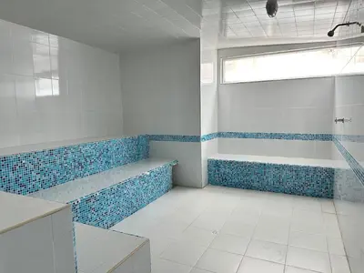 a bathroom with blue and white tiles and a shower at 2BR apartment Ocean & old city view in Cartagena de Indias
