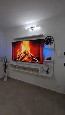 a living room with a fireplace on the wall at Apartamento completo, serena del mar, Capriella in Cartagena de Indias
