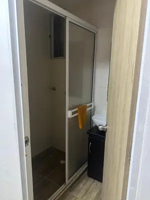 a glass shower in a bathroom with a sink at Apartment in Barranquilla in Barranquilla