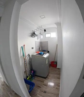 an attic room with a washer and dryer at Apartamento Mirador cerca al Centro Historico in Cartagena de Indias