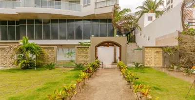 an external view of a house with a garden at Luxury Oceanfront Apartment Spiaggia 2BR 3BA Playa azul Cartagena in Cartagena de Indias