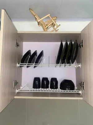 a cupboard with a row of pans on it at Apartaestudio Equipado a Menos de 100m de la Playa in Cartagena de Indias