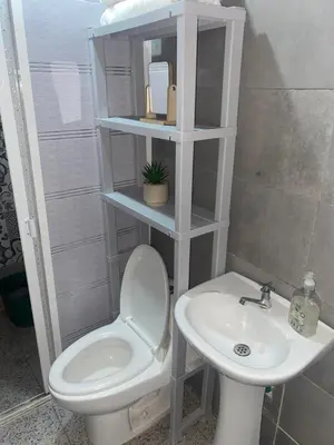 a bathroom with a toilet and a sink at Apartaestudio Equipado a Menos de 100m de la Playa in Cartagena de Indias