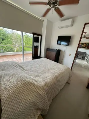 a bedroom with a bed and a ceiling fan at CONDOMINIO LAGUNA CLUB 