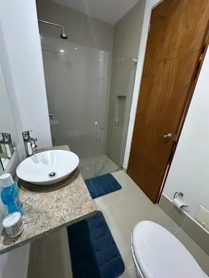 a bathroom with a sink and a toilet and a shower at CONDOMINIO LAGUNA CLUB 