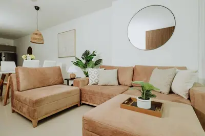a living room with a couch and a table at BEACH FRONT Condo walking to centro and beach 2BD in Cartagena de Indias
