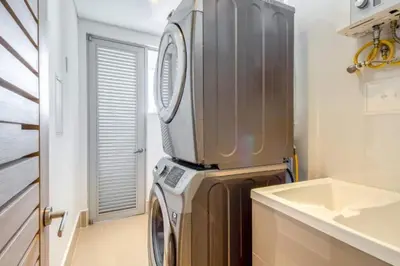 a washer and dryer in a kitchen with a sink at BEACH FRONT Condo walking to centro and beach 2BD in Cartagena de Indias