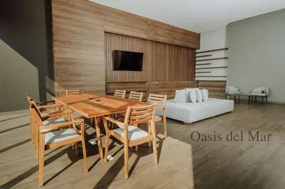 a dining room with a table and chairs and a couch at Cartagena View perfect for couples beach & walk in Cartagena de Indias