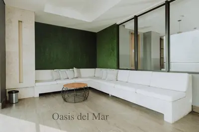 a living room with a white couch and a table at Cartagena View perfect for couples beach & walk in Cartagena de Indias