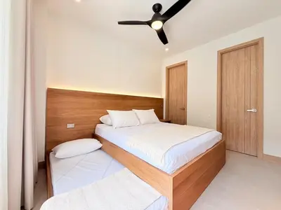 a bedroom with two beds and a ceiling fan at 2-Bedroom Apartment with Private Pool - Morros Kai in Cartagena de Indias