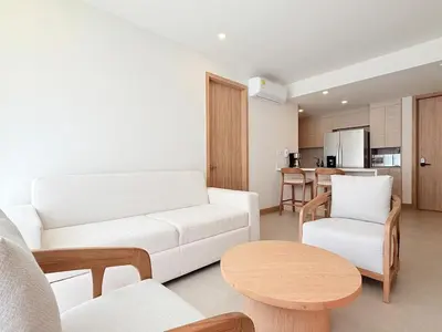a living room with a white couch and a table at 2-Bedroom Apartment with Private Pool - Morros Kai in Cartagena de Indias