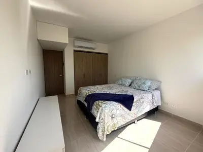 a bedroom with a bed in a small room at Serena del Mar in Cartagena de Indias